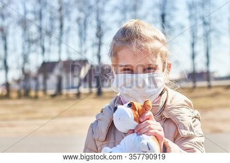 A Child With White Hair In A Jacket And Medical Mask. Prohibition Of School Attendance. Insulation.