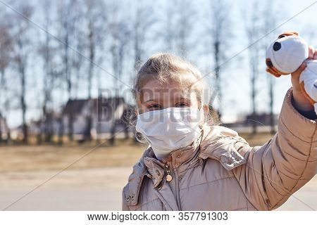 A Child With White Hair In A Jacket And Medical Mask. Prohibition Of School Attendance. Insulation.