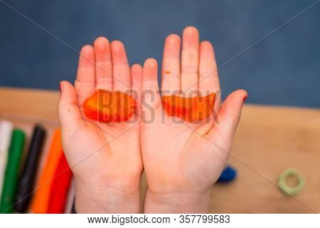 .child Playing With Plasticine And Making Molds