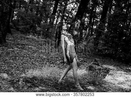 Forest Fairy. Living Wild Life Untouched Nature. Wild Woman In Forest. Sexy Girl Early Stage In The 