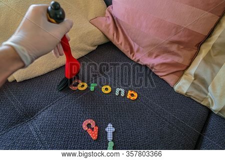 Corona Virus. A Little Boy Wipes The Corona Letters With A Brush Away, A Symbol For Fighting Back Ag