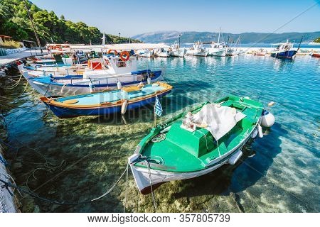 Colorful Greek Local Fishing Boats In Small Port Harbor Of Kioni On Ithaka Island, Greece