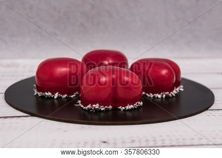 Close-up Of Mousse Cake With Red Mirror Glaze. Cooking French Dessert. Frozen Mirror Icing On The Ca