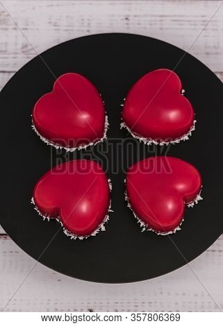 Close-up Of Mousse Cake With Red Mirror Glaze. Cooking French Dessert. Frozen Mirror Icing On The Ca