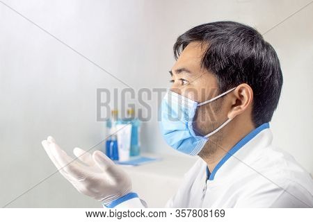 The Doctor Extended His Hand To Ask For Something Or Requesting Blessings From God In A White Room A