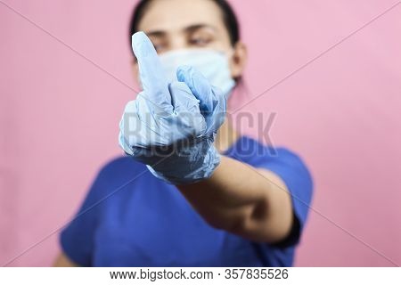Woman Showing Middle Finger Handgesture. Get Out Covid-19 Or Stop Coronavirus Concepts. Time To Stay