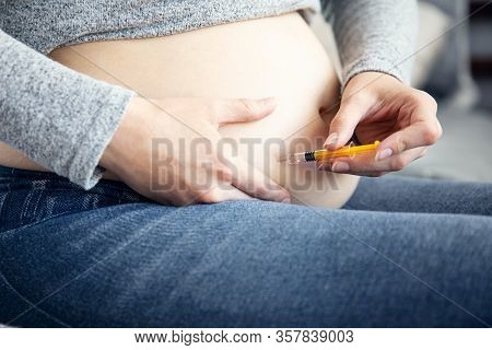Pregnant Woman Makes An Injection With One-use Syringe At Home
