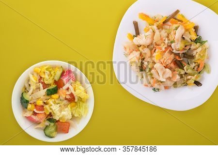 Pickled Vegetables On A White Plate. Vegetarian Food On A Yellw Background. Rustic Food.flat Lay