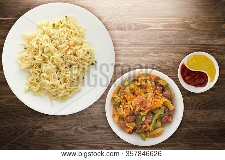 Vermicelli On A White Plate On Brown Wooden Background. Vermicelli On A Plate With Vegetarion Salad 