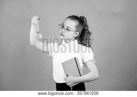 Back To School. Small Smart Girl With Testing Flask. Education And Knowledge. Child Study Bilogy Les