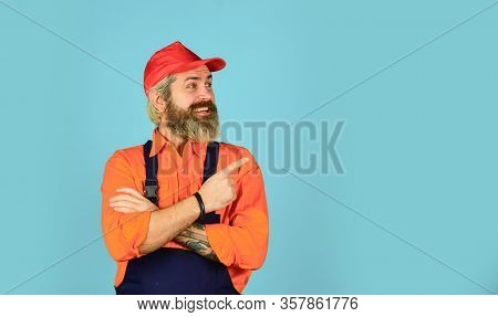 Mad Repairman Concept. Man Wear Boilersuit. Bearded Worker In Overalls. Confident Mature Mechanic. P