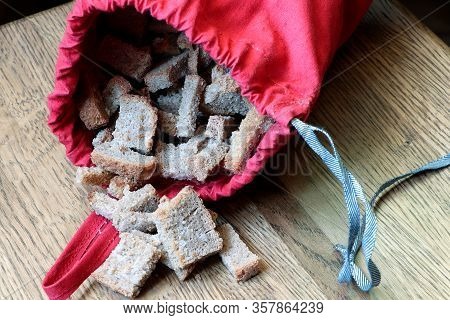 Croutons. Dried Bread, Crust. Bread Crumbs. Bread Dentil In A Pocket. Red Sack With Bread Dentil.