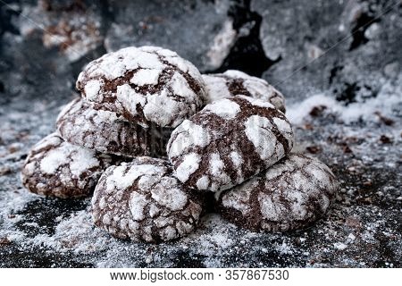 Freshly Backed Sweet Chocolate Cookies At Baking Sheet. Cookies Sprinkled With Powdered Sugar