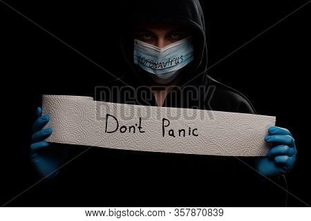 Panic Buying Covid-19 Coronavirus Outbreak Concept. Roll Of Toilet Paper With Inscription Dont Panic