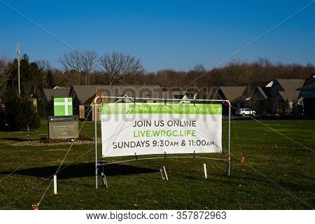 Macedonia, Oh, Usa - March 25, 2020: A Church Banner Advertises Online Services During Closure Of In