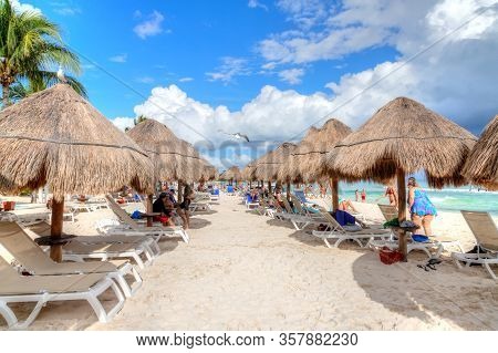 Riviera Maya, Mexico - Dec. 22, 2019: Beachgoers Flock To The Tropical Beaches Of Riviera Maya Near 