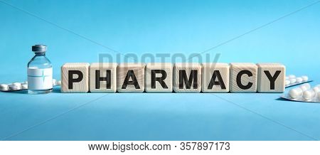 Pharmacy - Text On Cubes. Drug In Ambula, Tablets In Blisters To Reduce Disease Symptoms