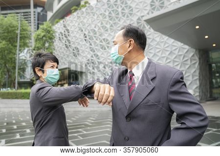 Old Asian Business People Greeting Togather By New Methode With Mask For Prevent Covid 19, This Imag