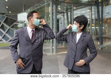 Old Asian Business People Greeting Togather By New Methode With Mask For Prevent Covid 19, This Imag