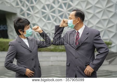 Old Asian Business People Greeting Togather By New Methode With Mask For Prevent Covid 19, This Imag