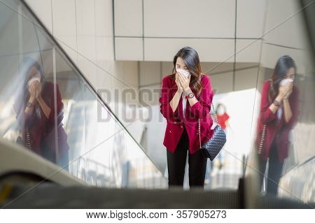 Asian Girl Use A Protection Mask For Prevent Pm 2.5 And Corona Viruus Or Covic 19 In Office In Bangk