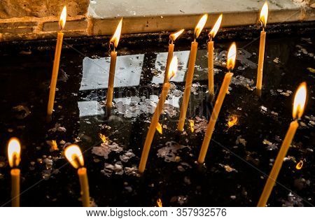 Burning Candles For Dead Or Alive People At Orthodox Or Catholics.