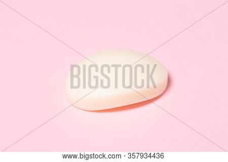 White Bar Of Soap On Pink Background. Hugiene Concept.