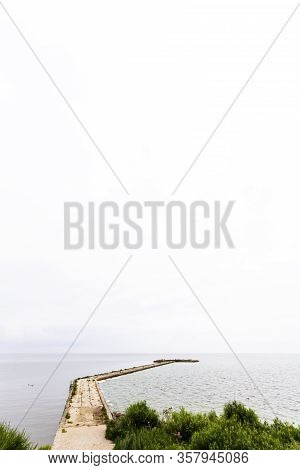 Vente Cape In Lithuania. View Of A Pier In The Sea.