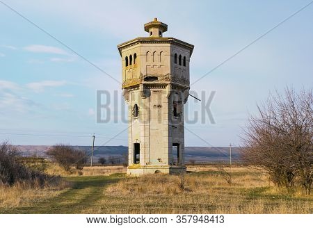 Old Abandoned Beton Water Tower In Steppe Near Stavropol, Russia, Built In 1910s