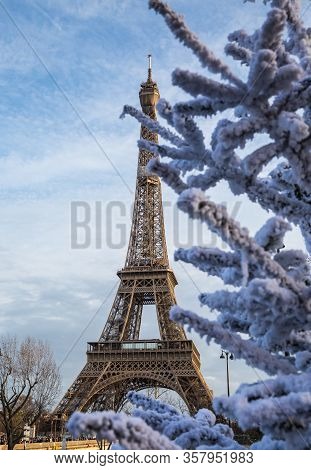 Paris Street With View On The Famous Paris Eiffel Tower On A Cloudy Rainy Day.