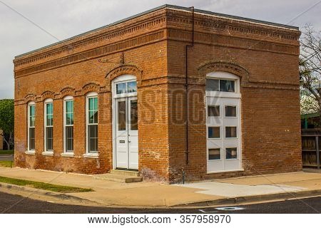 Old Corner Brick Building With Double Door Access