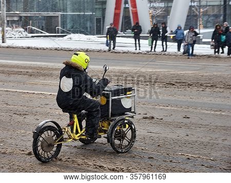 Tricycle Food Delivery Man Crosses The Road, At The Facility, Haze And Moire From Falling Heavy Snow