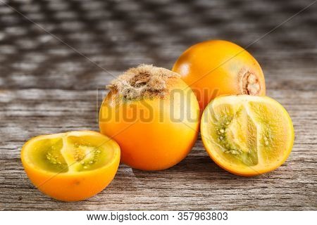 Fruit Of Lulo Or Naranjilla On Wood