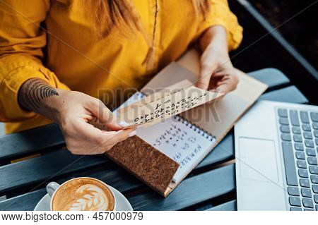 Modern Astrologer Numerologist Woman Working And Writing In Notepad Numbers. Numerology, Astrology