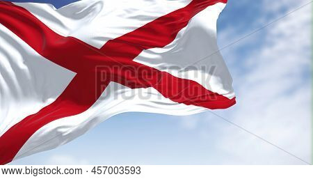 Close Up Of The Alabama State Flag Waving In The Wind. Alabama Is A State In The Southeastern Region