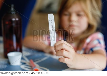Covid-19 Testing Children. Sad Child Holding Self Rapid Test With Positive Result. Coronavirus Testi