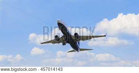 Long Shot Of The Underbelly Of A Flying Plane