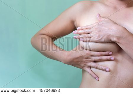 Young Topless Woman Doing Breast Self-exam (bse). Checking Up Breast Changes, Possible Lumps, Distor