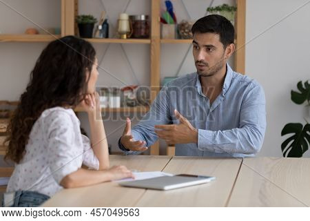 Two Businesspeople Take Part In Business Meeting In Office