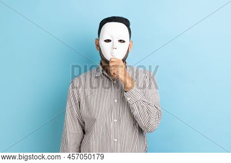 Portrait Of Anonymous Unknown Businessman Covering Her Face With White Mask, Hiding Her Real Persona