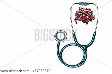 Green Stethoscope With Pile Of Red-grey Capsule Pills Isolated On White Background With Copy Space. 