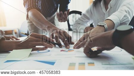 Team Of Business People Working Together In The Meeting Room Office, Teamwork Background Charts And 