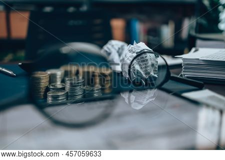 Magnifying Glass See Coin And Fail Paper Crump.  Accounting  Check   Financial Path Concept..