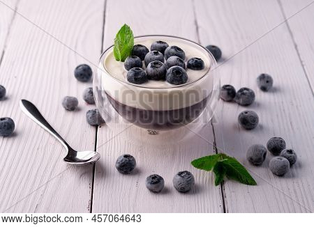Pana Cotta Dessert With Blueberries In A Glass Bowl