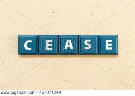Tile Alphabet Letter In Word Cease On Wood Background