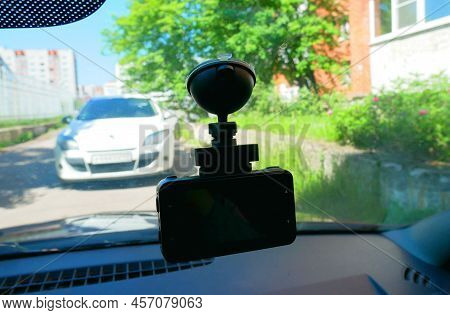 Installing The Dvr In The Car. Dvr On The Windshield Of The Car.