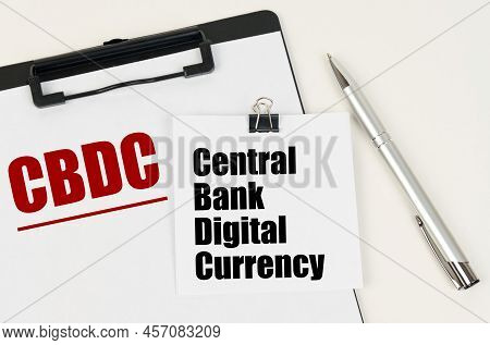 Business Concept. On The Tablet Is A Sheet Of Paper With The Inscription - Cbdc And Stickers With Th