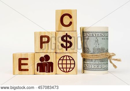 Business Concept. On A White Surface, Dollars And Cubes With Images And The Inscription - Epc
