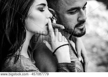 Cuban Cigar. Sensual Latino Couple. Latin Men Enjoing And Relaxing With Love Women. Couple Enjoy In 