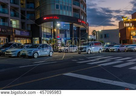 Cars Parked In Front Of Hotel.